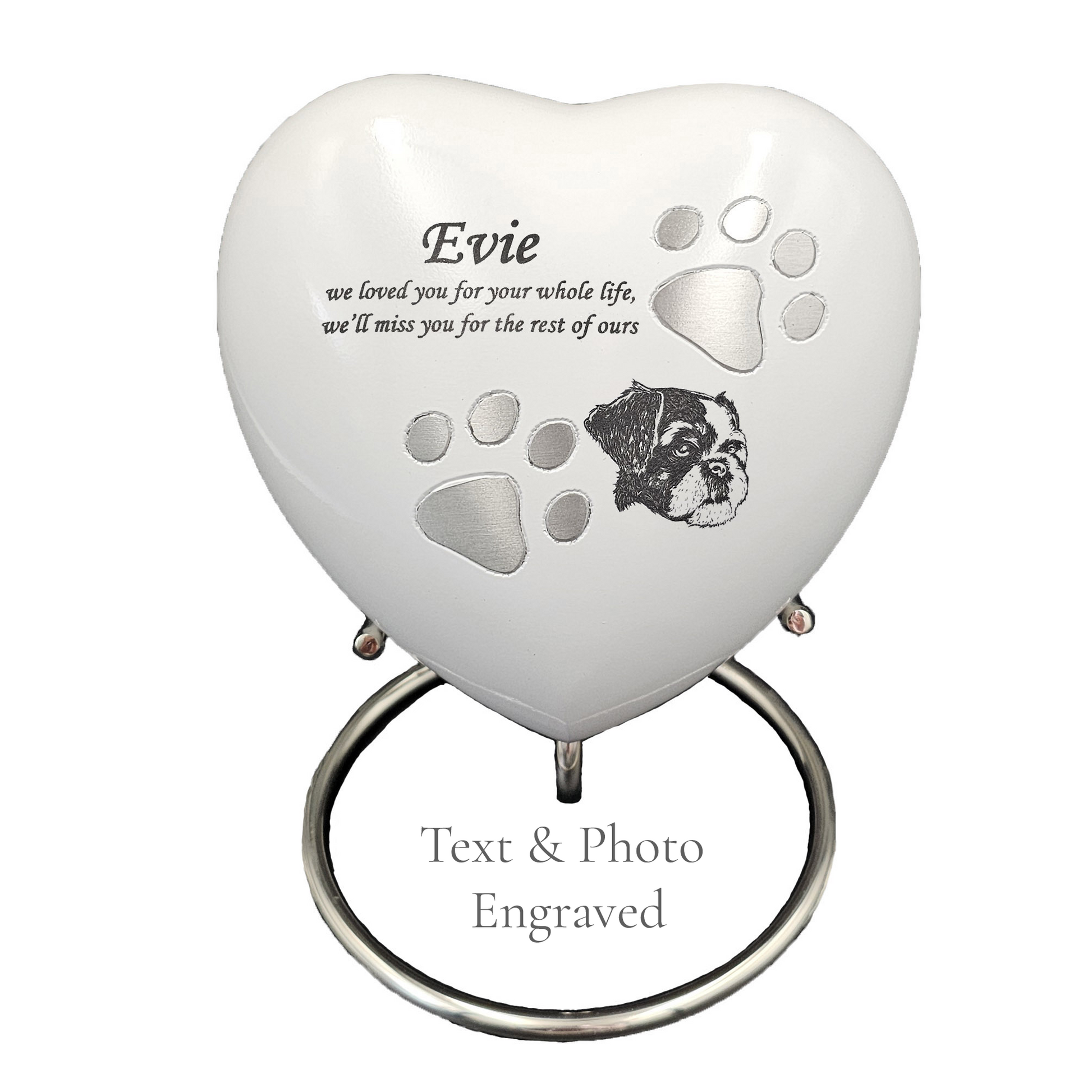 Heart-shaped pet memorial with engraved text and photo on a white heart urn