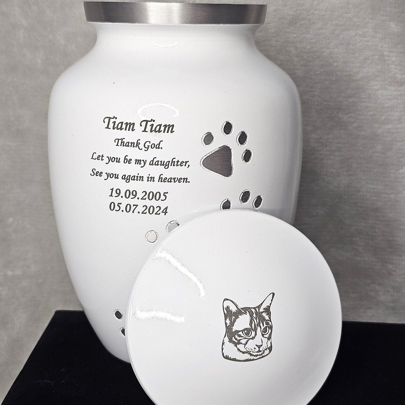 White jar, silver paw prints, text engraved and lid engraved withimage